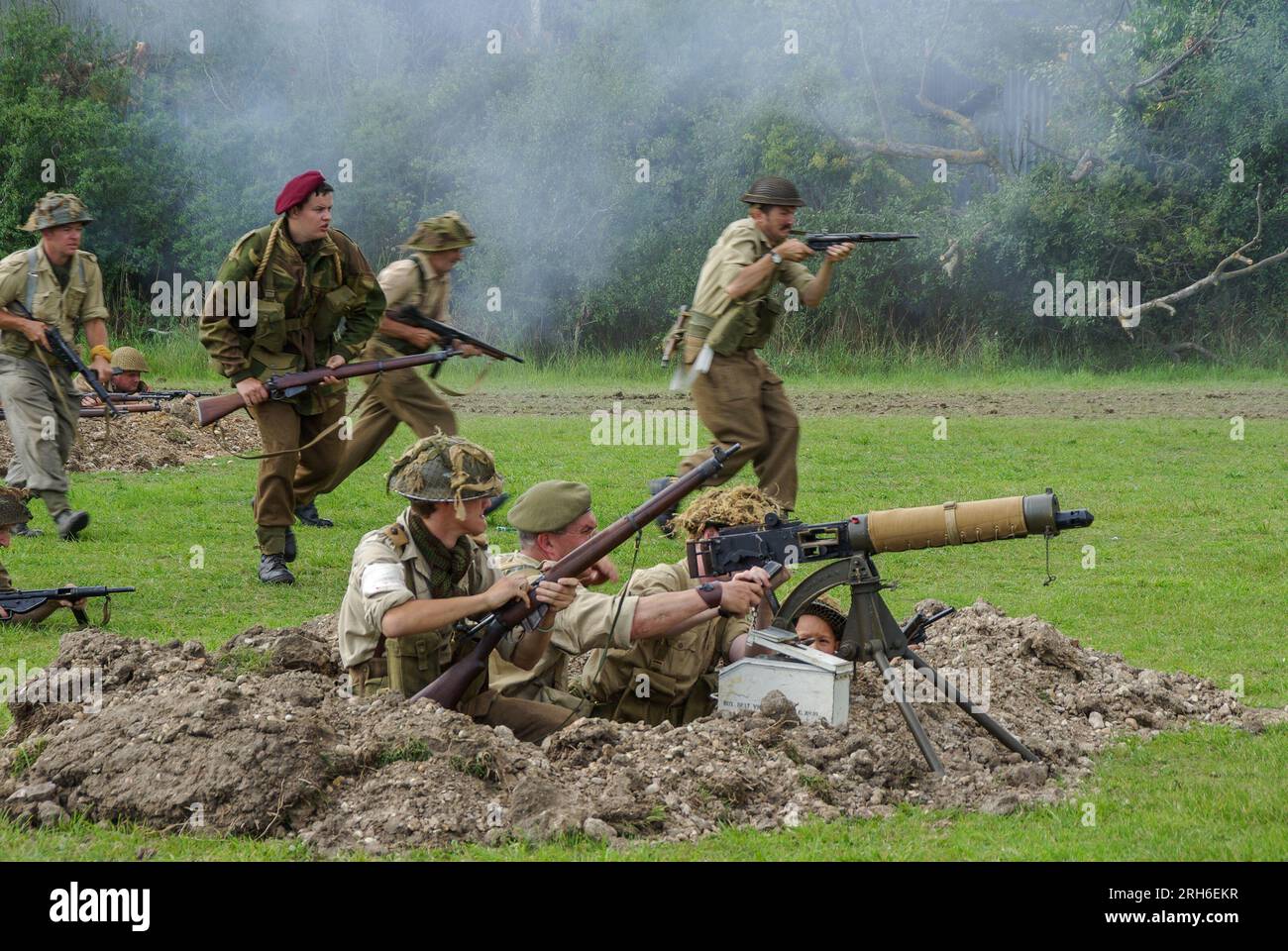 British soldiers battle reenactment advancing in a rural scenario. Mix
