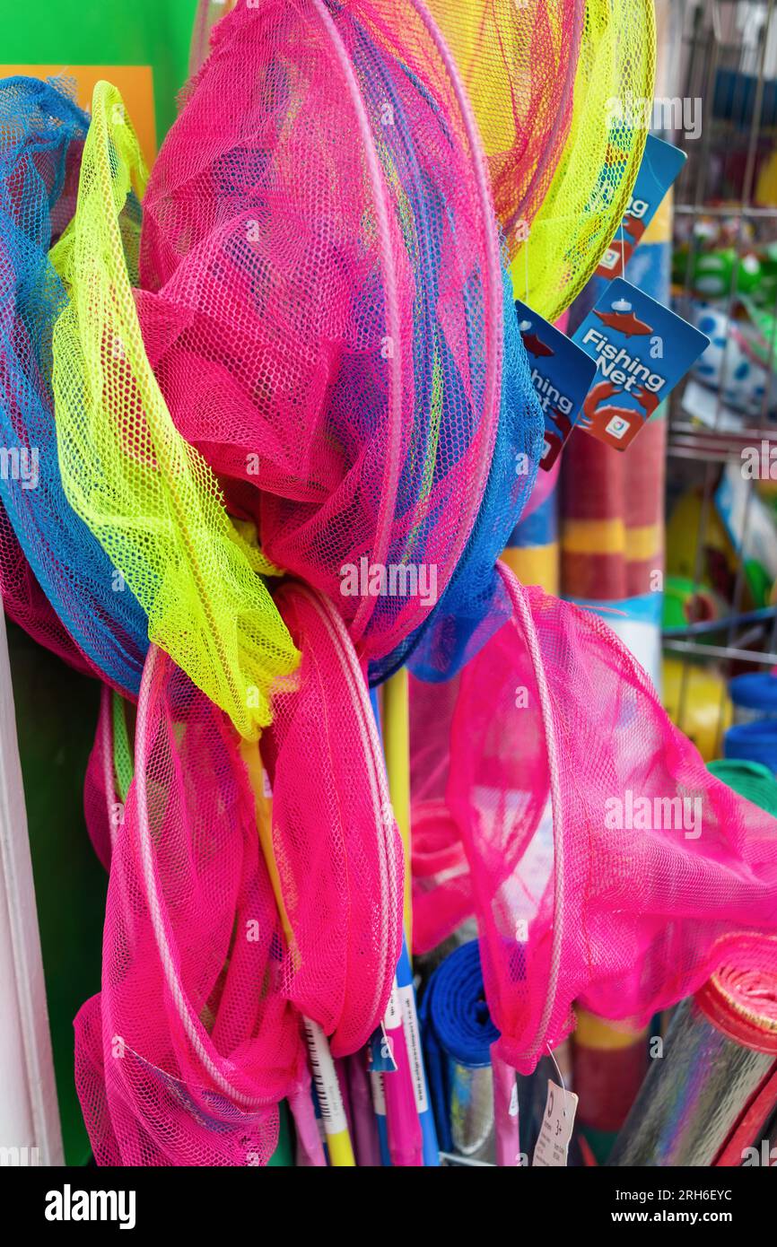 Colourful, childrens' fishing nets for a fun trip down to the stream or  seaside! Stock Photo - Alamy