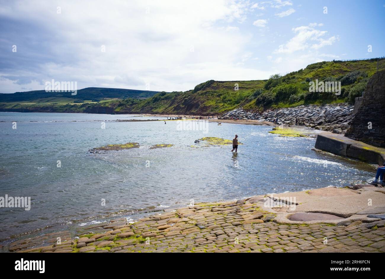 Access to the beach at Robin Hood's Bay is limited at High Tide Stock