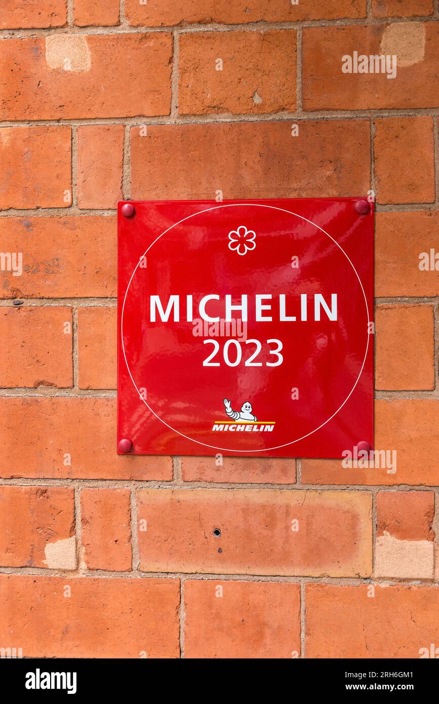 Michelin 2023 one star plaque mounted on wall outside Purnells restaurant in Birmingham, UK Stock Photo