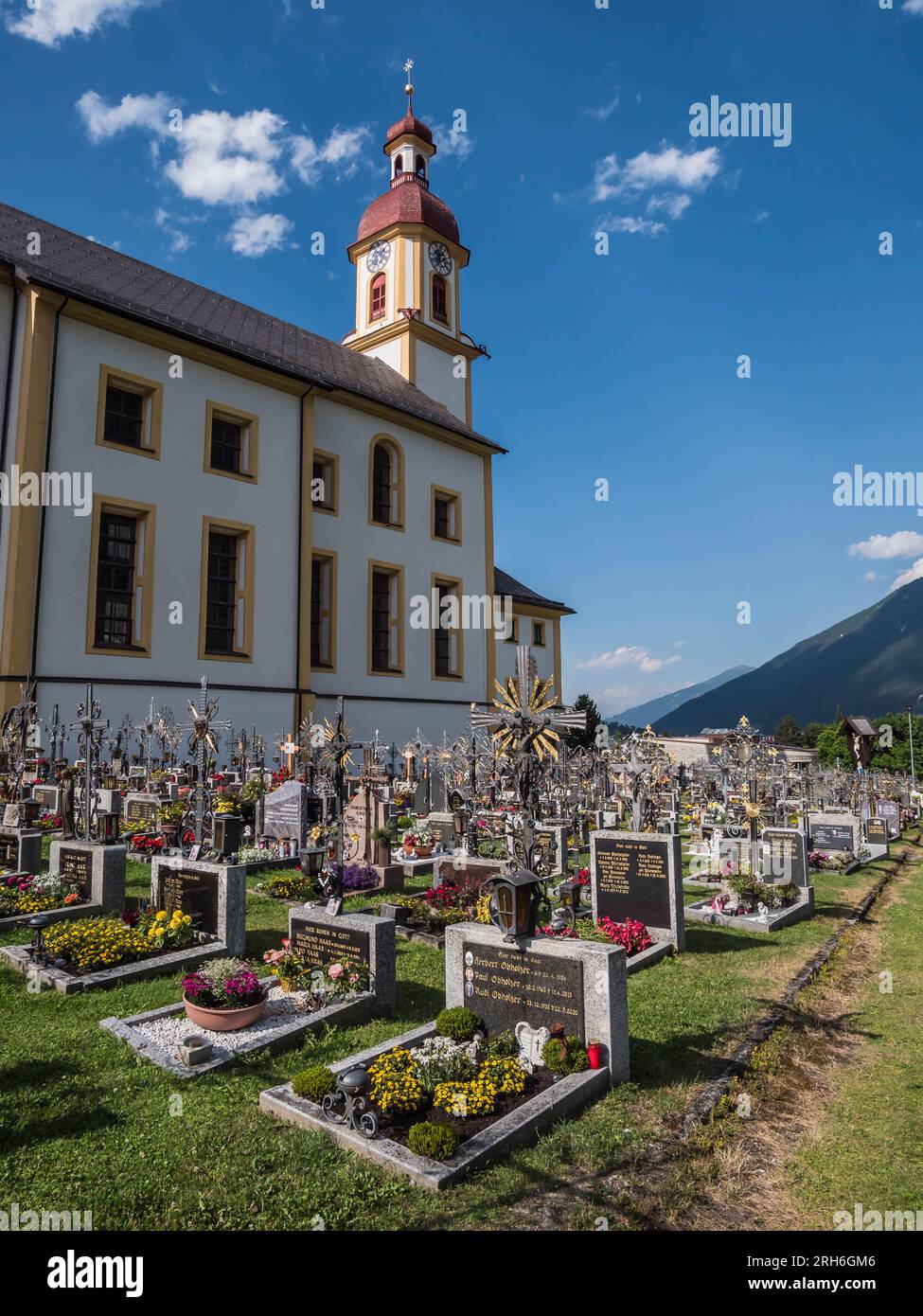 The image is of St Georg's Kirche Freidhof, St George's Church cemetery in Neustift, the principle village and tourist centre in the Stubaital valley Stock Photo