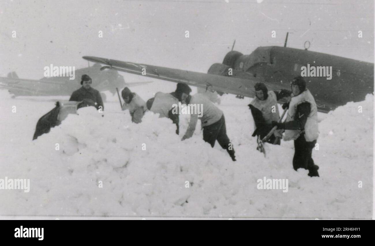 SS Photographer, Geyk  (Russia) Winter scenes - digging vehicles out of snow, fighting positions, clearing snow from airfield with JU-52 and JU-188; awards formation in field with Sepp Dietrich and other officers; soldier show; heavy artillery; destroyed city and port scenes; captured Russian tank with German flag; observation post; destroyed Sevastopol fortifications; field airfield with JU-52s; aerial views of landscape; fighting positions in mountainous terrain; several images of General Hermman Hoth; Nebelwerfer firing, Panzerkampfwagen 38(t) Stock Photo