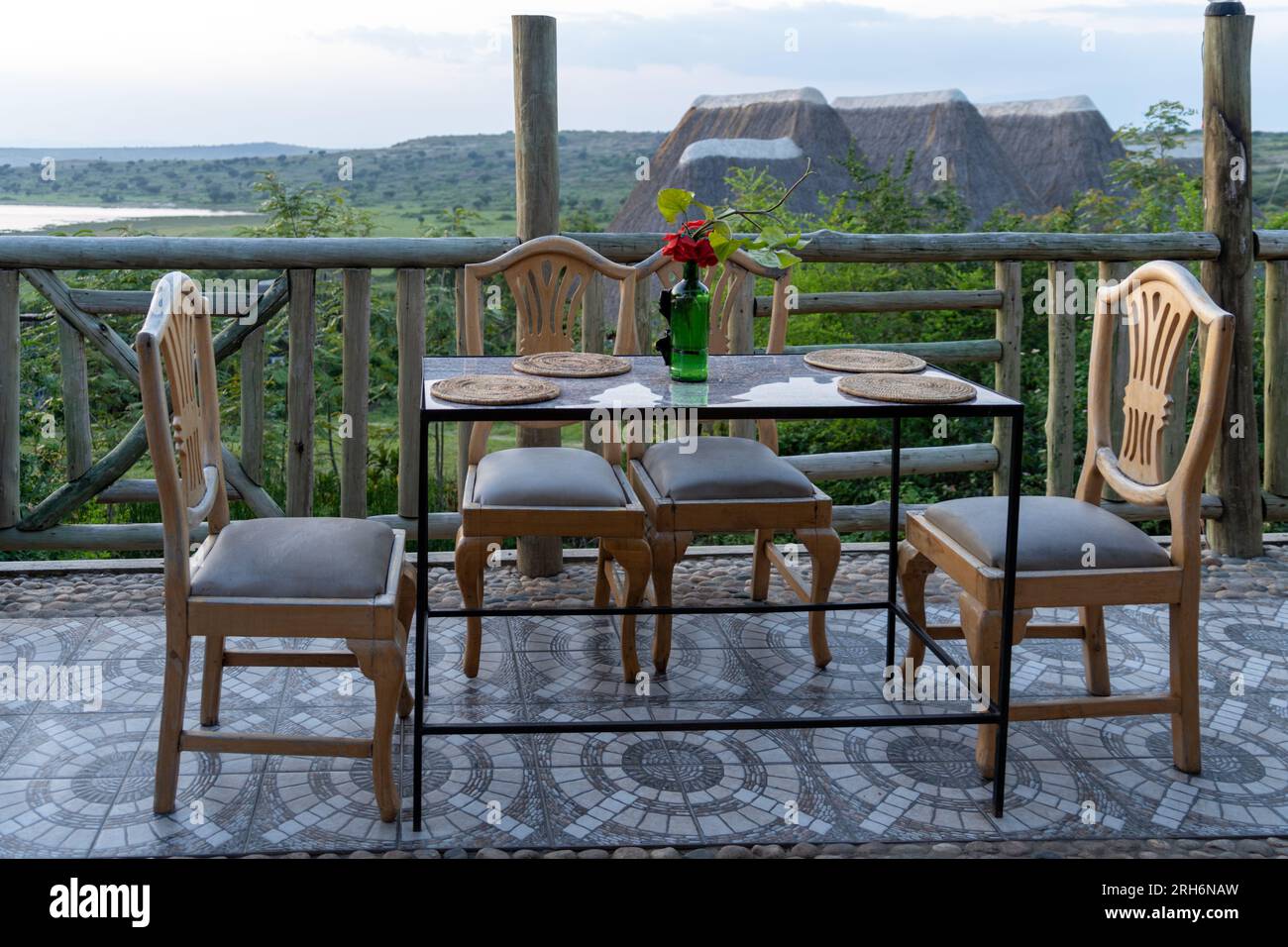 Table at an outdoor dining restaurant at a safari lodge in Uganda, Chairs, table, placements and