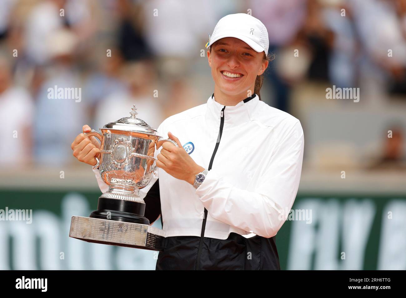 Holding success trophy smiling winning professional sportsperson hires