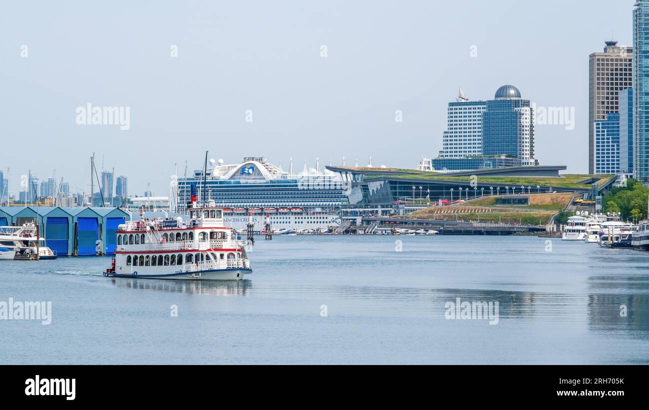 Tourist boat enters the harbour in downtown Vancouver. Stock Photo