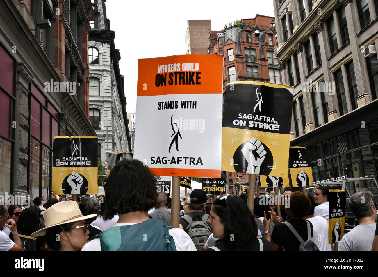 Picketers carry signs on the picket line outside Netflix on Monday, Aug ...
