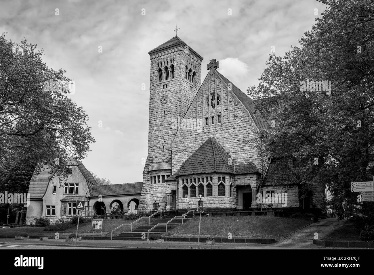 Bochum, Germany - May 10, 2022: Evangelical Lutheran Church in the city park of Bochum, Ruhr area, North Rhine-Westphalia, Germany. Black and white ph Stock Photo