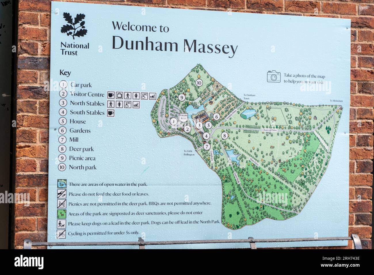 to Dunham Massey information and map sign Stock Photo Alamy