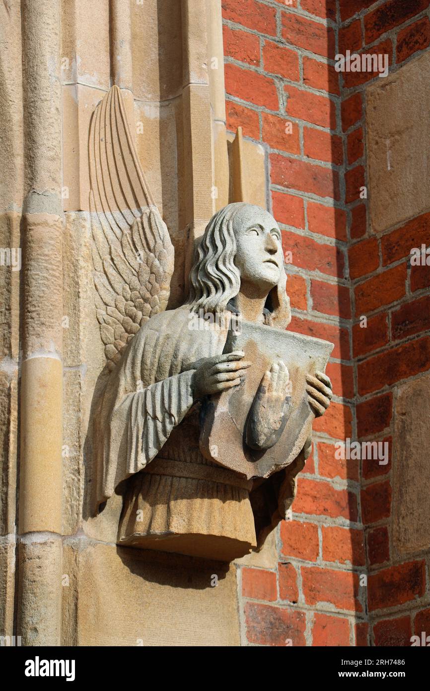 Angel holding the Hand of Ulster at the entrance to Queens University in Belfast Stock Photo