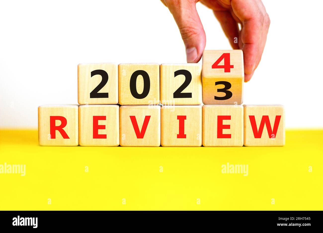 2024 Review New Year Symbol Businessman Turns A Wooden Cube And Changes Words Review 2023 To 2024 Review New Year Symbol Businessman Turns A Wooden Cube And Changes Words Review 2023 To