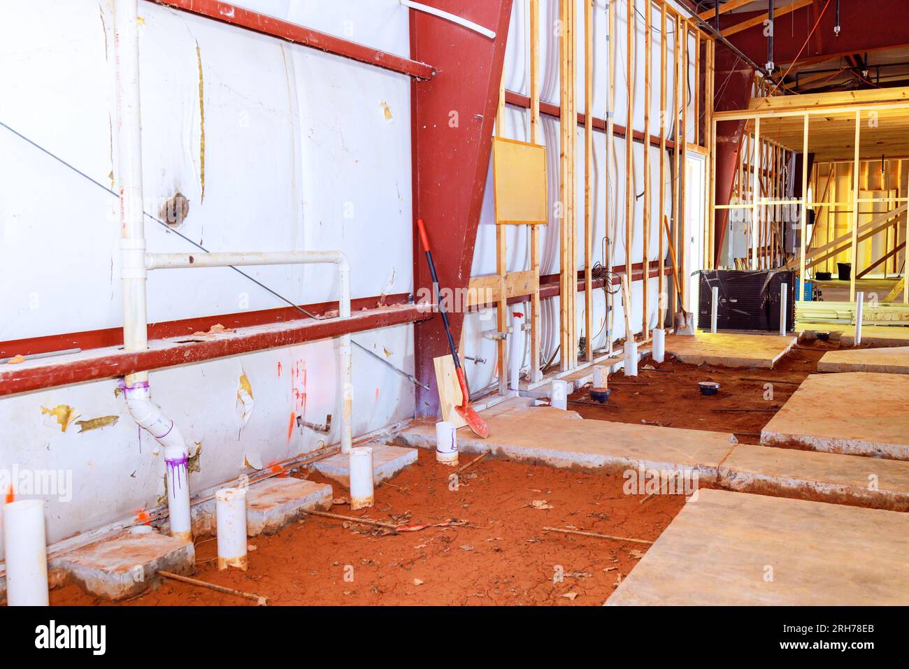 Future plumbing concrete floor with exposed drainage pvc pipe endings