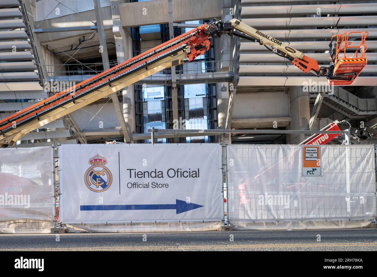 Madrid, Spain. 14th Aug, 2023. A sign indicates the location of the Real Madrid official store outside the Santiago Bernabeu football stadium it goes through the last stage of completing its new design and full renovation. The entire project has a reported cost of nearly €1 billion and is expected to be completed by the end of 2023. Credit: SOPA Images Limited/Alamy Live News Stock Photo