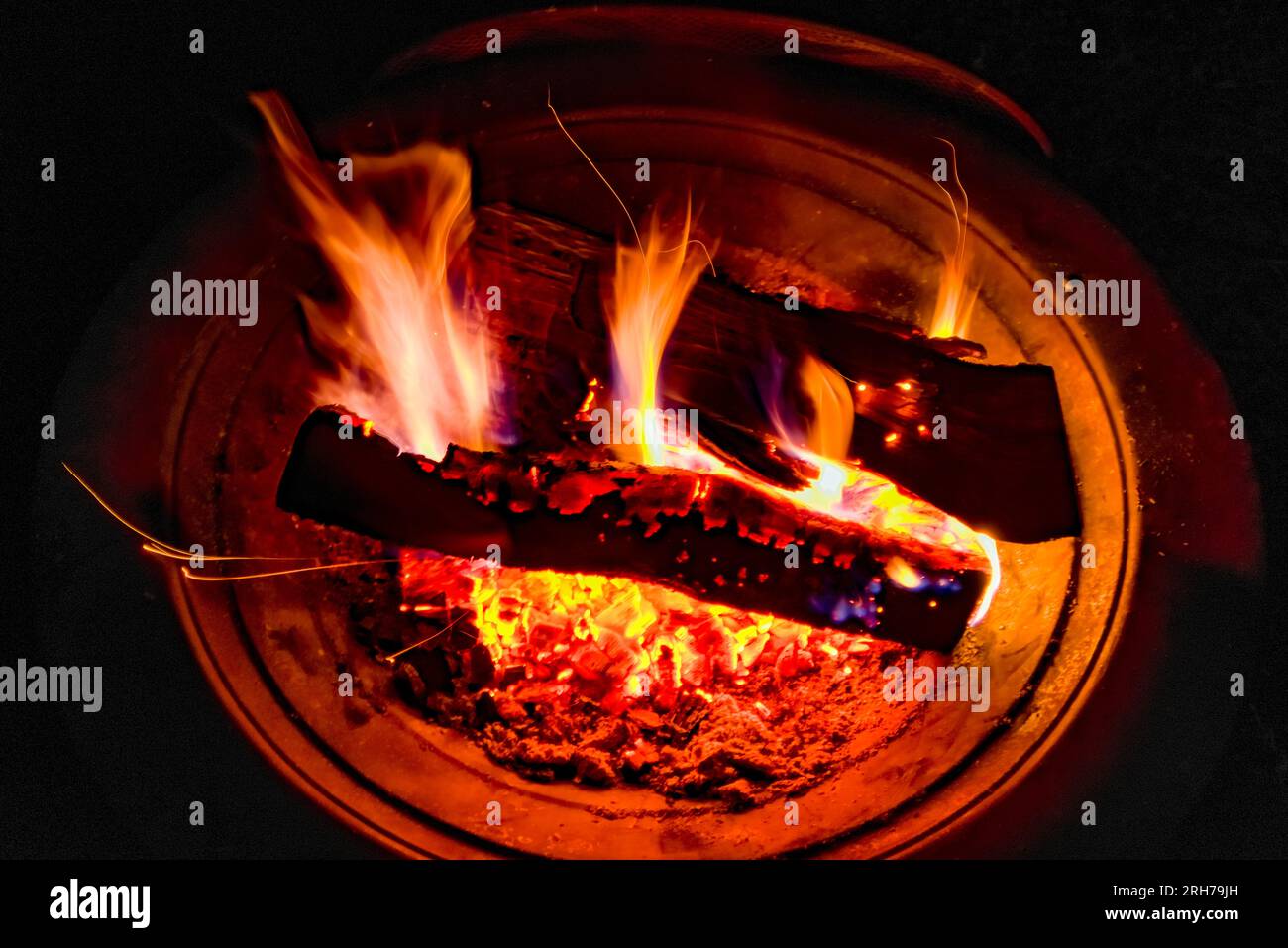 A camp fire burns in the night. Stock Photo