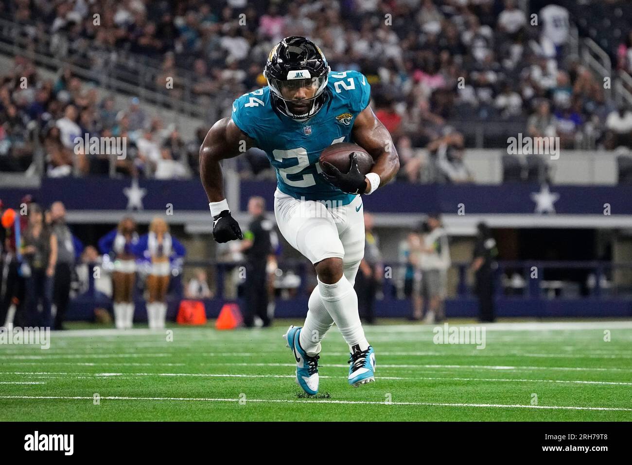 Jacksonville Jaguars running back Snoop Conner runs with the ball during  the second half of an NFL preseason football game against the Dallas Cowboys,  Saturday, Aug. 12, 2023, in Arlington, Texas. (AP