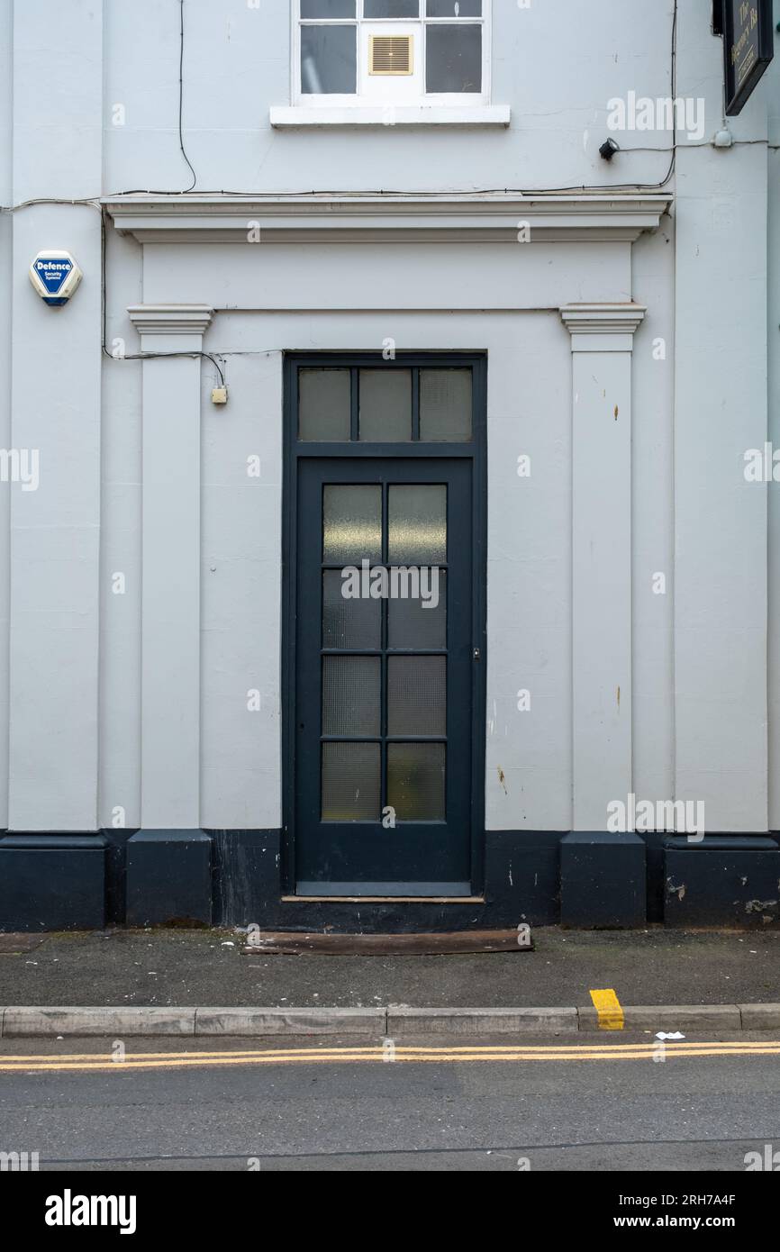 Glass paneled door on a white building, Cheltenham, UK Stock Photo