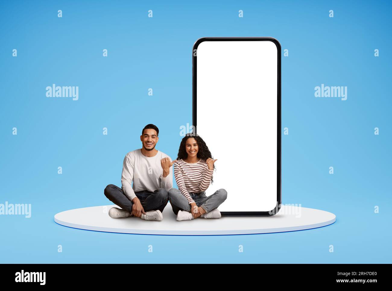 Happy Young Arab Couple Pointing At Big Blank Smartphone With White ...
