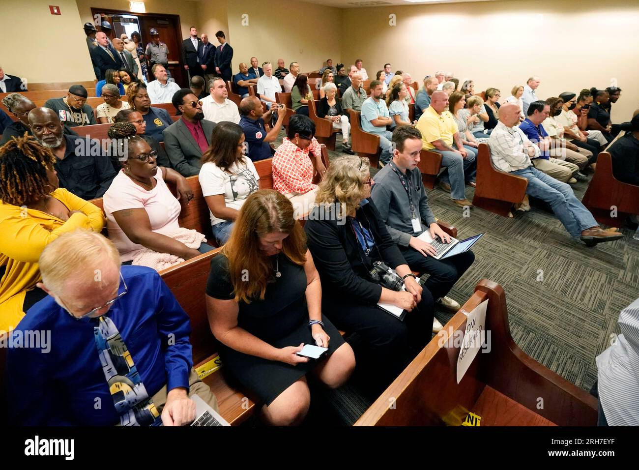 A full courtroom of journalists, family and friends attend a hearing in the Rankin County