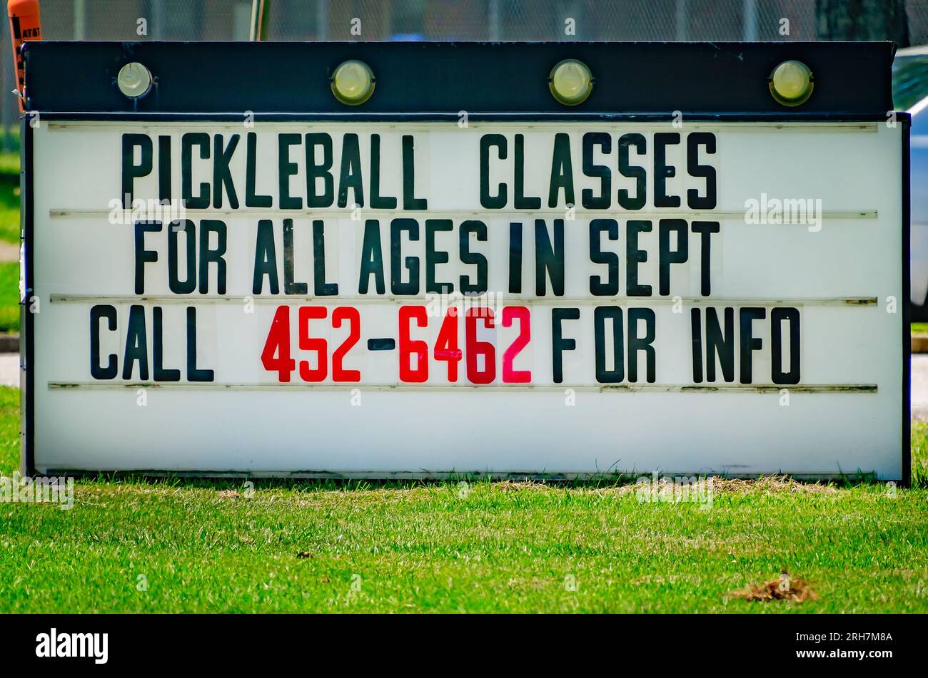 Pickleball classes for all ages are advertised on a sign, Aug. 12, 2023, in Chickasaw, Alabama. Pickleball was invented in 1965. Stock Photo