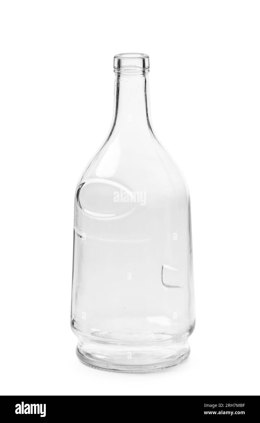 An empty bottle for alcoholic beverages made of transparent glass of a beautiful unusual shape, isolated on a white background. Bottle for cognac, whi Stock Photo