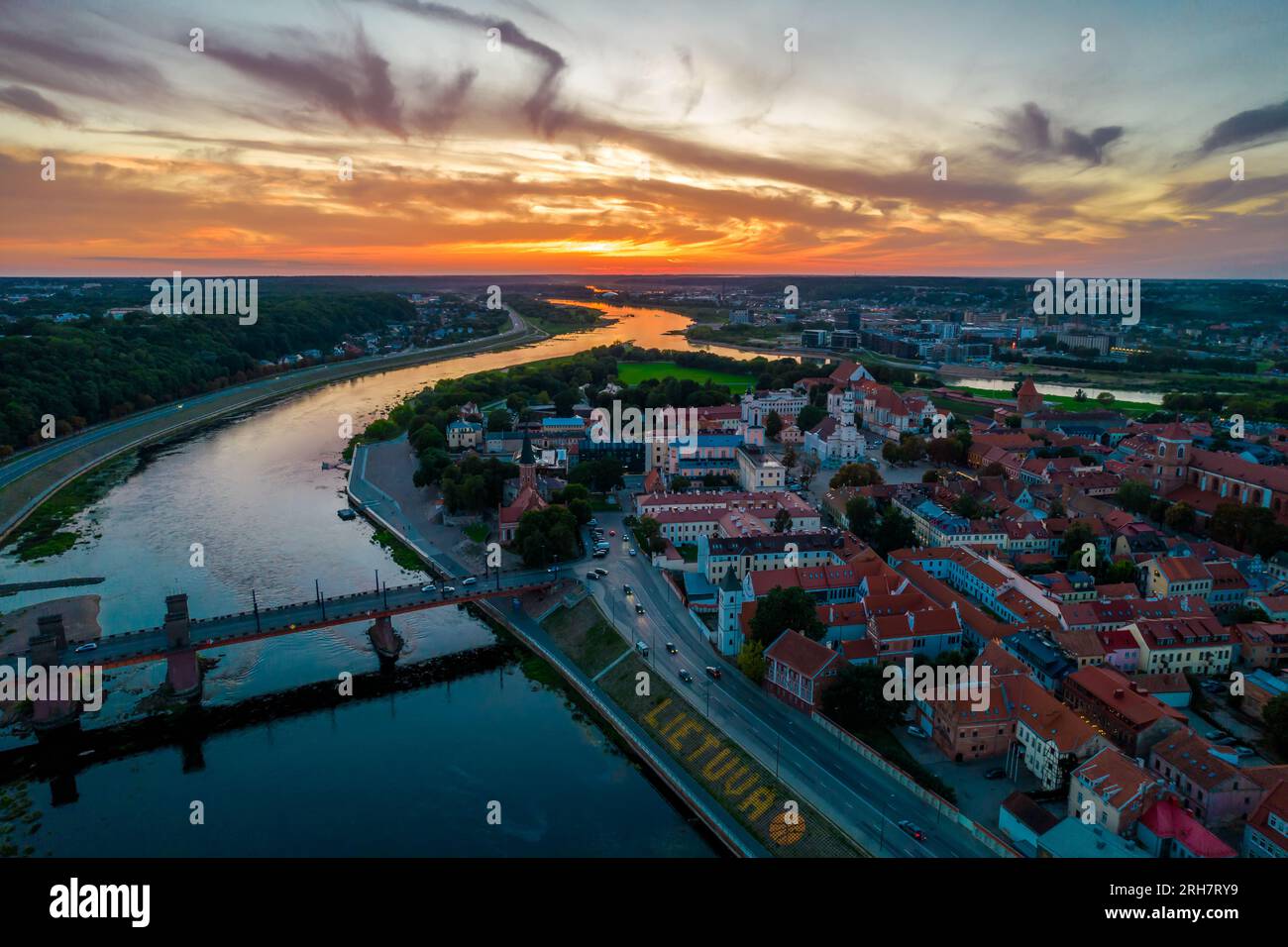 Kaunas old town, Lithuania. Aerial view of a colorful summer sunset over the city and and large inscription Lithuania with basketball on the shore Stock Photo