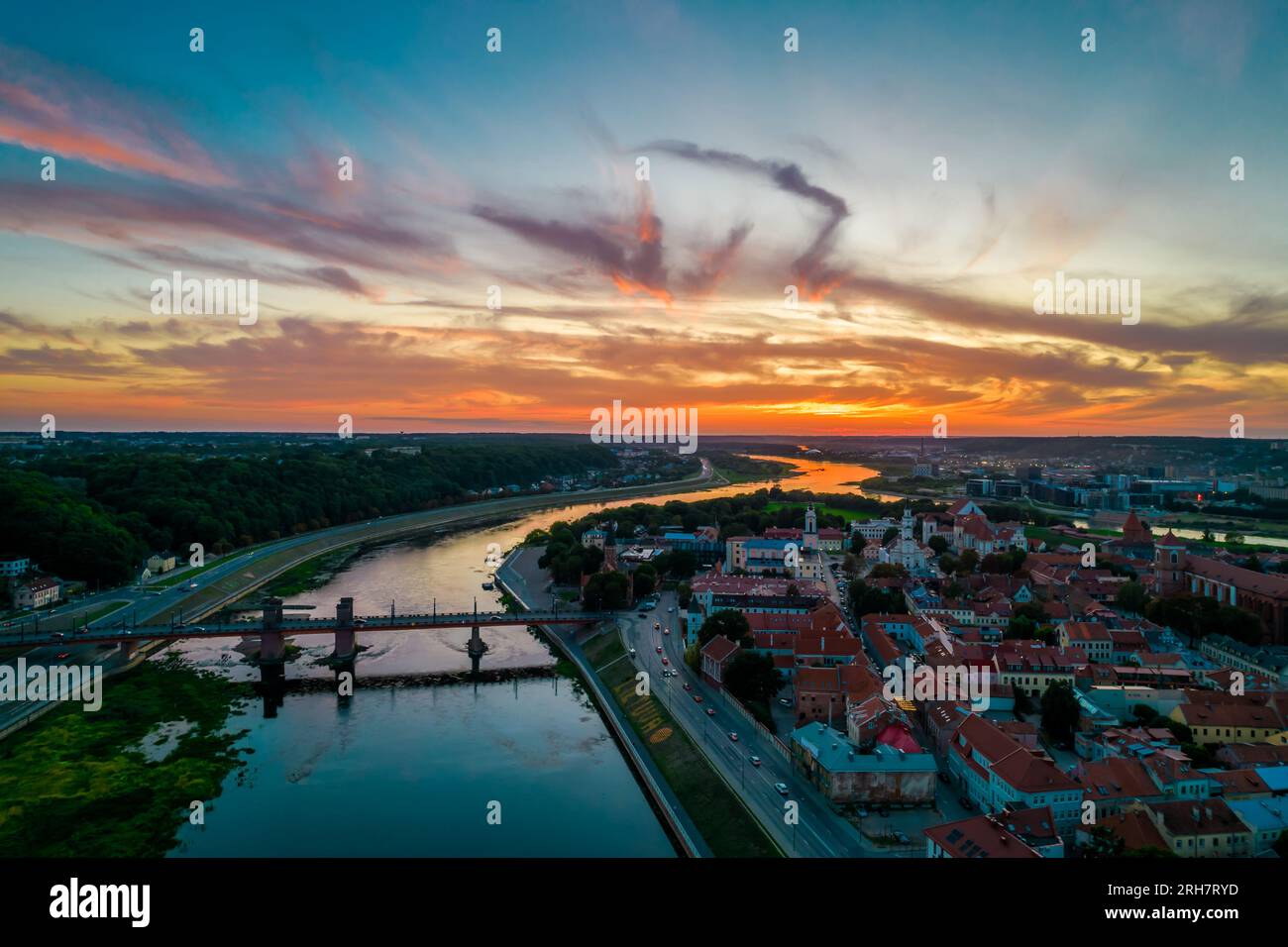Kaunas old town, Lithuania. Aerial view of a colorful summer sunset over the city and and large inscription Lithuania with basketball on the shore Stock Photo