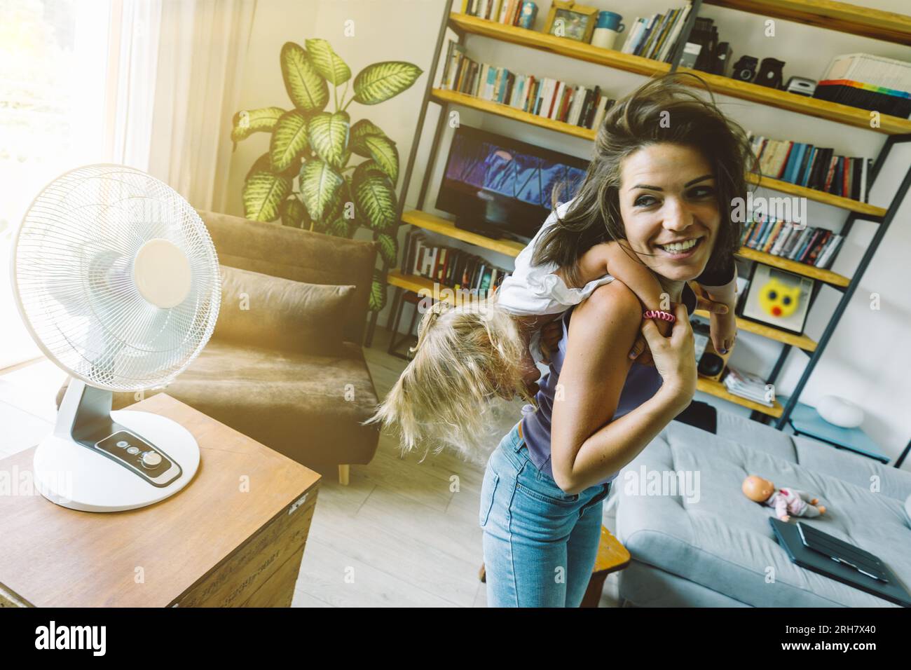 Playing With Fans Mother, daughter play with fan; physical dance and flights forget the ...
