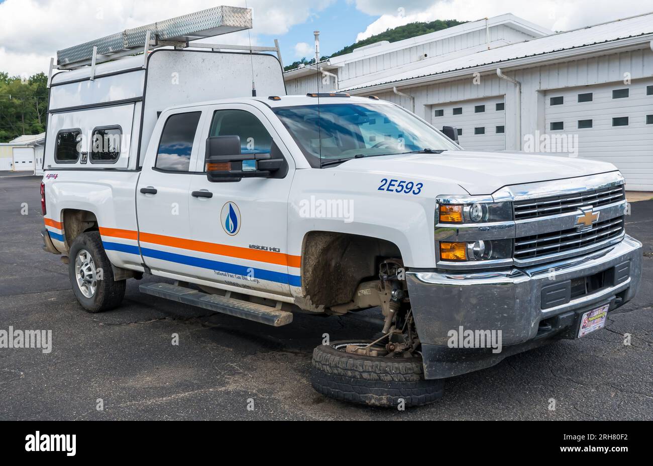 A work truck with a broken axle at a dealership waiting to be repaired in Starbrick, Pennsylvania, USA Stock Photo