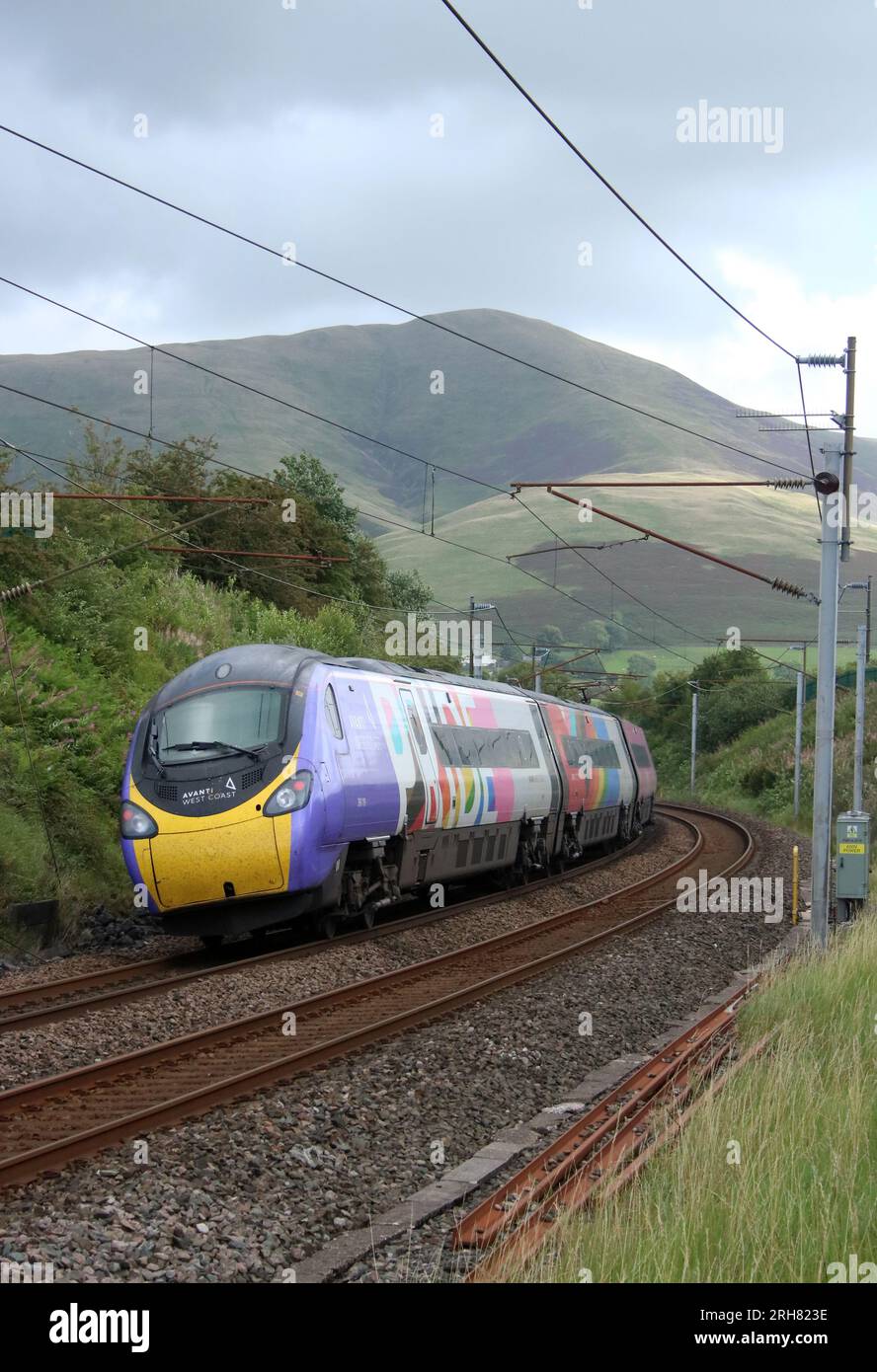 Avanti West Coast class 390 pendolino electric multiple unit in special Pride livery on West Coast Main Line at Lowgill, Cumbria, 11th August 2023. Stock Photo