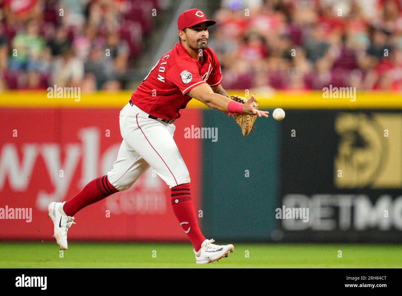 Cincinnati Reds first baseman Christian EncarnacionStrand throws to