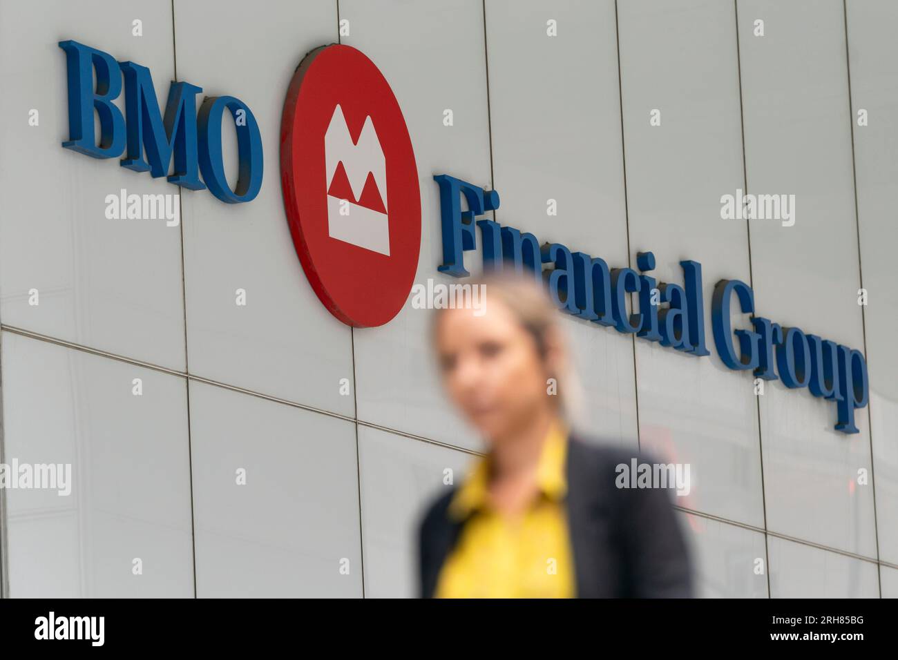 Toronto, Canada. 14th Aug, 2023. A person makes their way past the Bank of  Montreal (BMO) building in the Financial District of Toronto, on Monday,  Aug. 14, 2023. Credit: The Canadian Press/Alamy