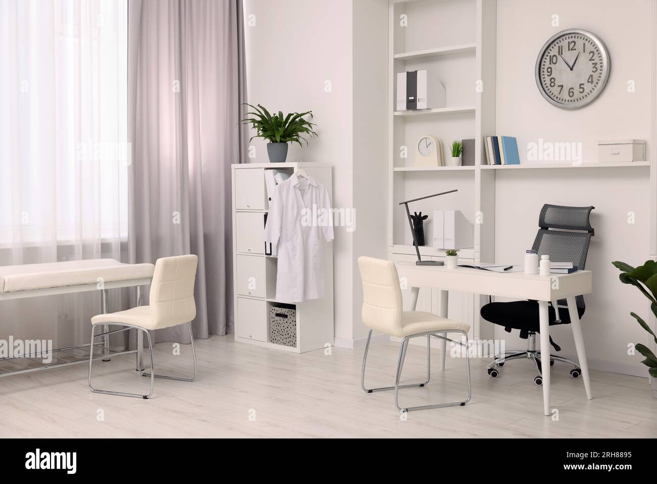 Modern medical office interior with doctor's workplace and examination ...