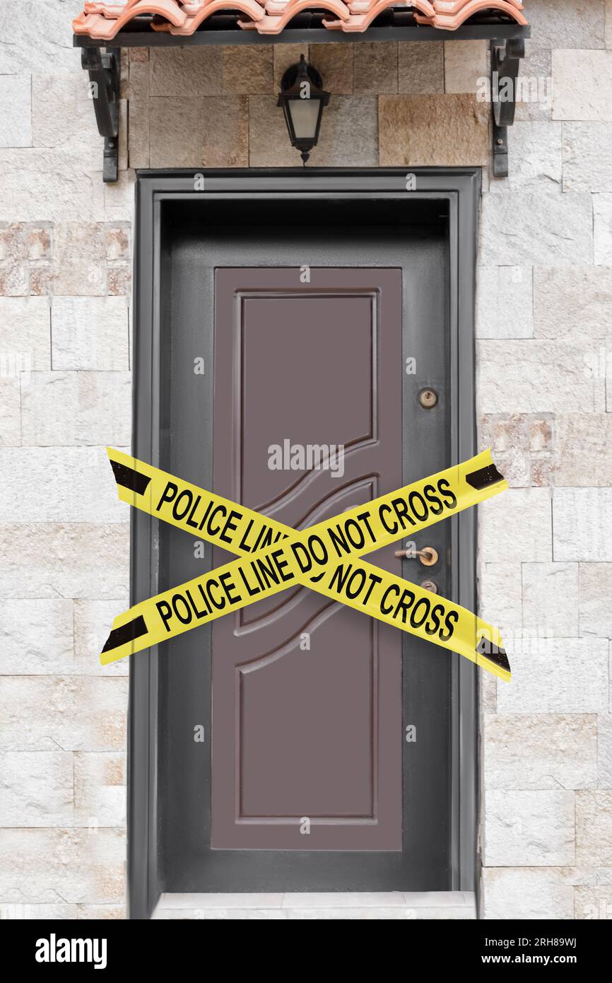 Yellow crime scene tape blocking entrance to house Stock Photo Alamy