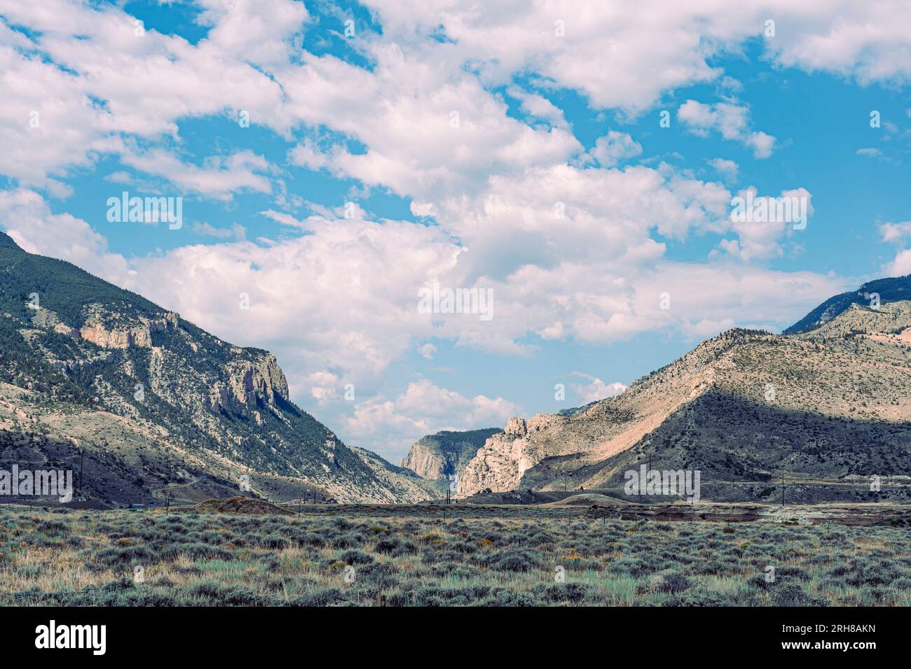 Beautiful blue sky with clouds shows the mountain pass to Yellowstone