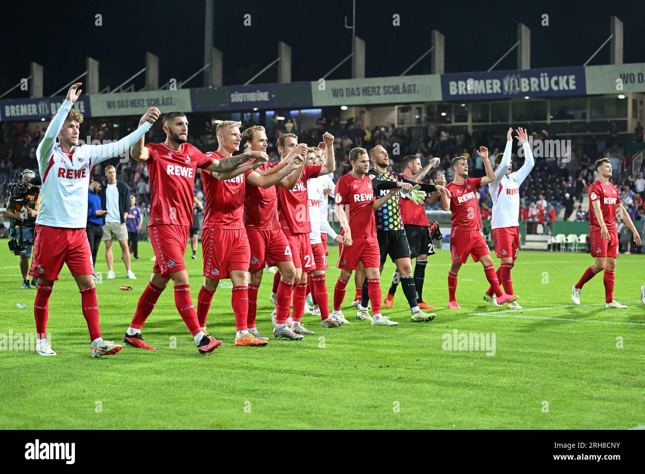 Osnabruck. 14th Aug, 2023. Players of FC Koln greet the audiance after winning the German Cup 1st round match between FC Koln and VfL Osnabruck in Osnabruck, Germany on Aug. 14, 2023. Credit: Ulrich Hufnagel/Xinhua/Alamy Live News Stock Photo