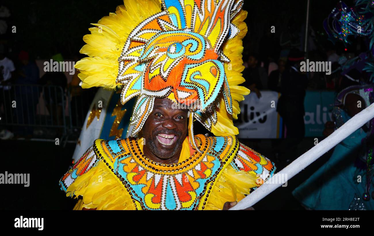 People of African descent, and black people dancing in the street in the Caribbean at the Junkanoo Street Carnival parade Stock Photo