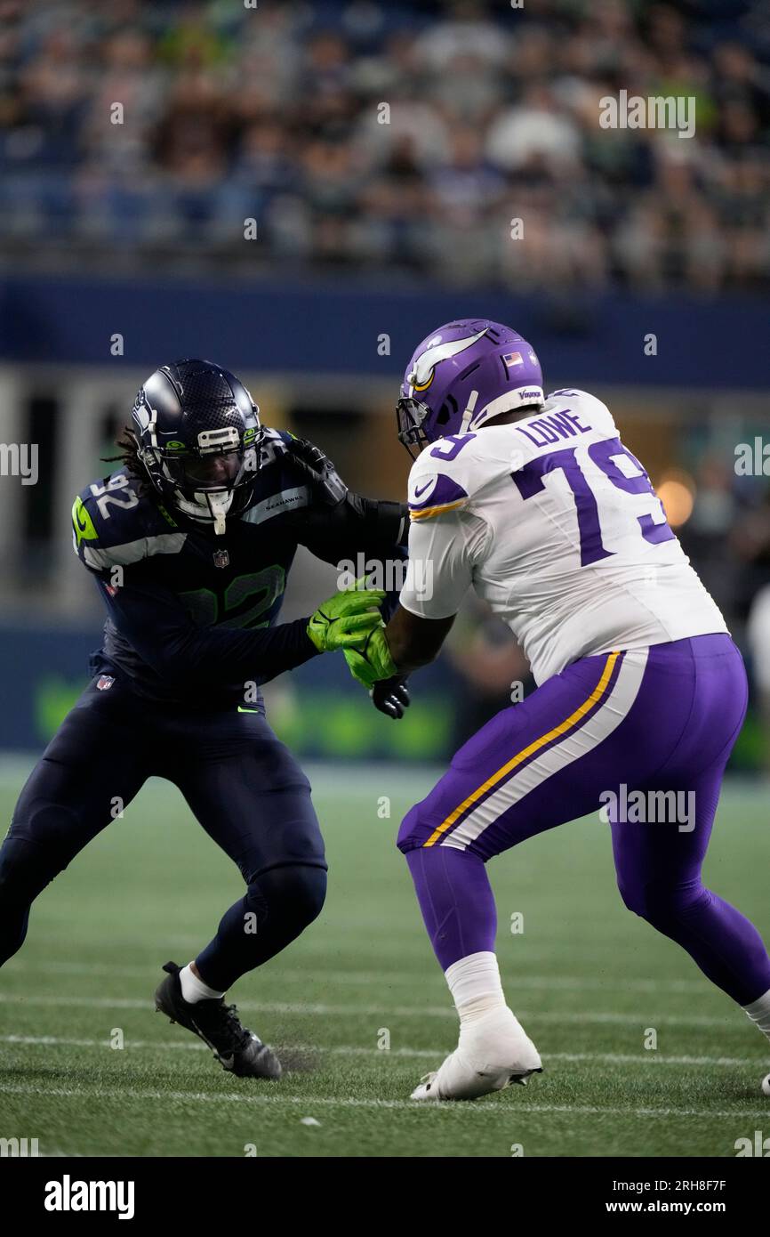 Minnesota Vikings offensive tackle Vederian Lowe (79) and Seattle Seahawks  linebacker Tyreke Smith (92) face off during an NFL pre-season football  game, Thursday, Aug. 10, 2023 in Seattle. (AP Photo/Ben VanHouten Stock