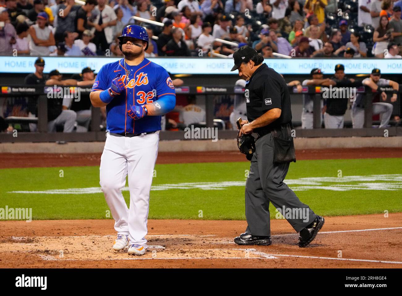 Pittsburgh Pirates' Daniel Vogelbach listens to home plate umpire