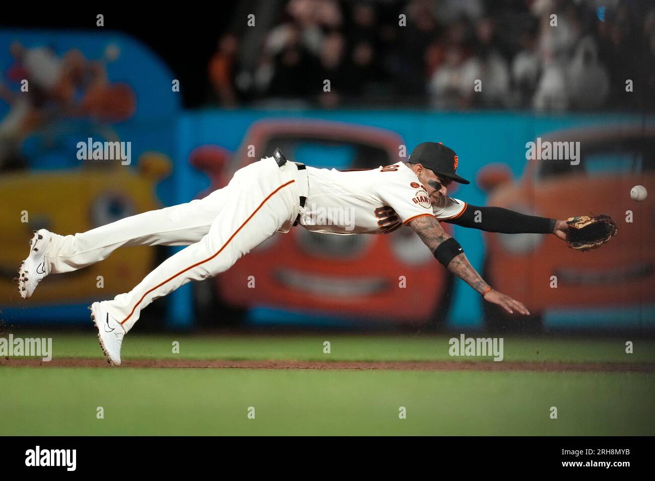 San Francisco Giants' Johan Camargo cannot reach an RBI double hit by