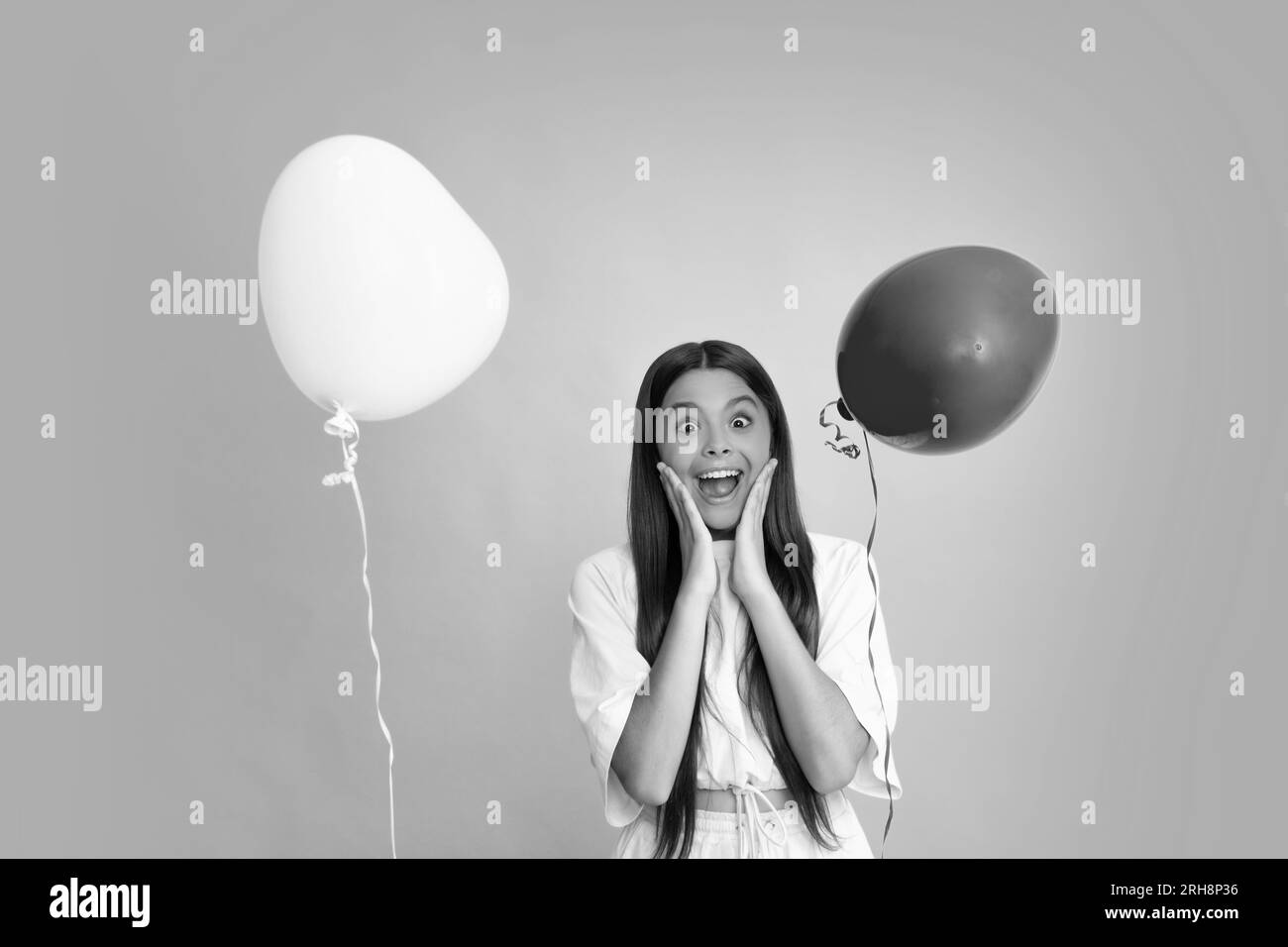 Valentines day and kids concept. Teenage girl in yellow dress with red