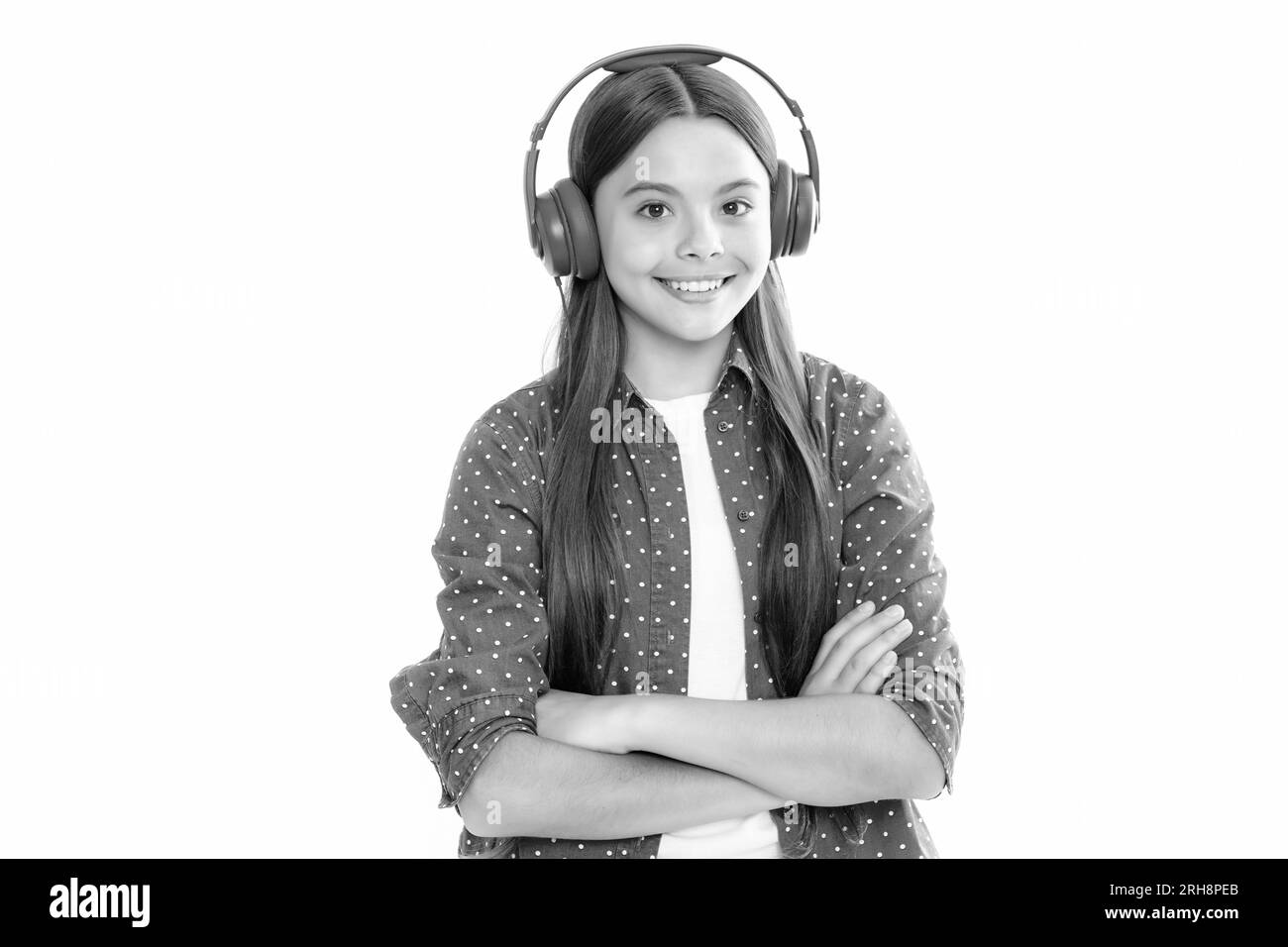 Child listening music with headphones. Girl listening songs via