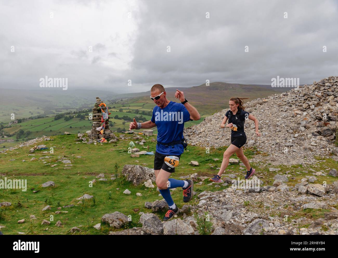Runners in a race on the hills above Reeth in North Yorkshire. Stock Photo