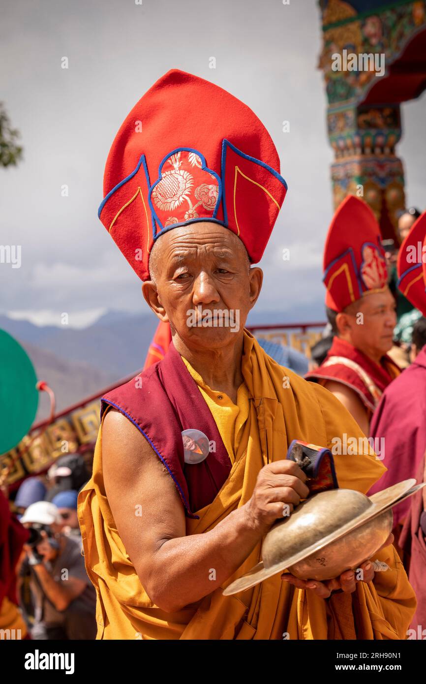 India, Ladakh, Leh Valley, Sakti, Takthok, Tak tok, Nying-ma-pa, Red Hat sect monastery, Tsechu, elderly musician monk playing holy tingsha cymbal Stock Photo