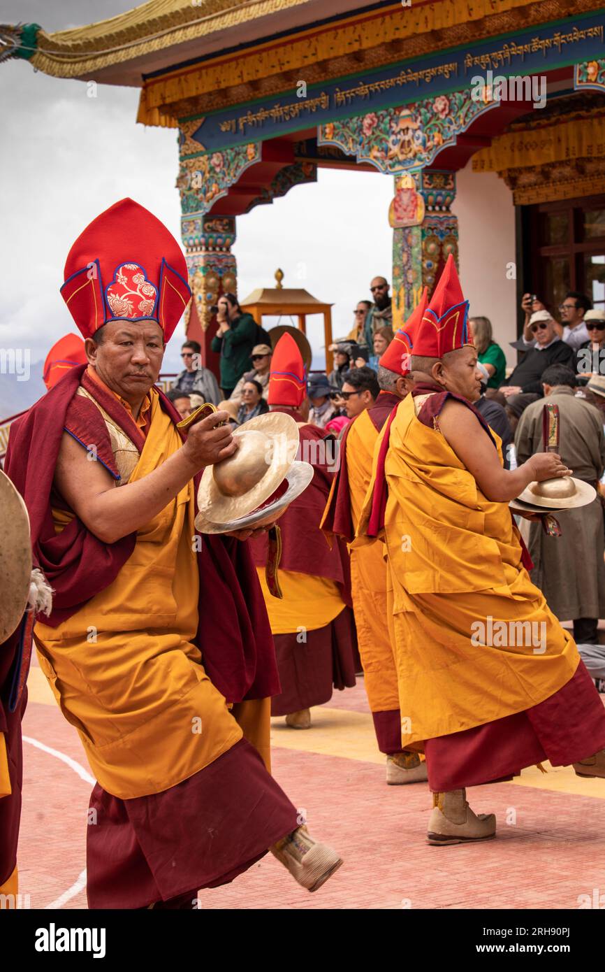 India, Ladakh, Leh Valley, Sakti, Takthok, Tak tok, Nying-ma-pa, Red Hat sect monastery, Tsechu, elderly musician dancing,  monks playing holy tingsha Stock Photo