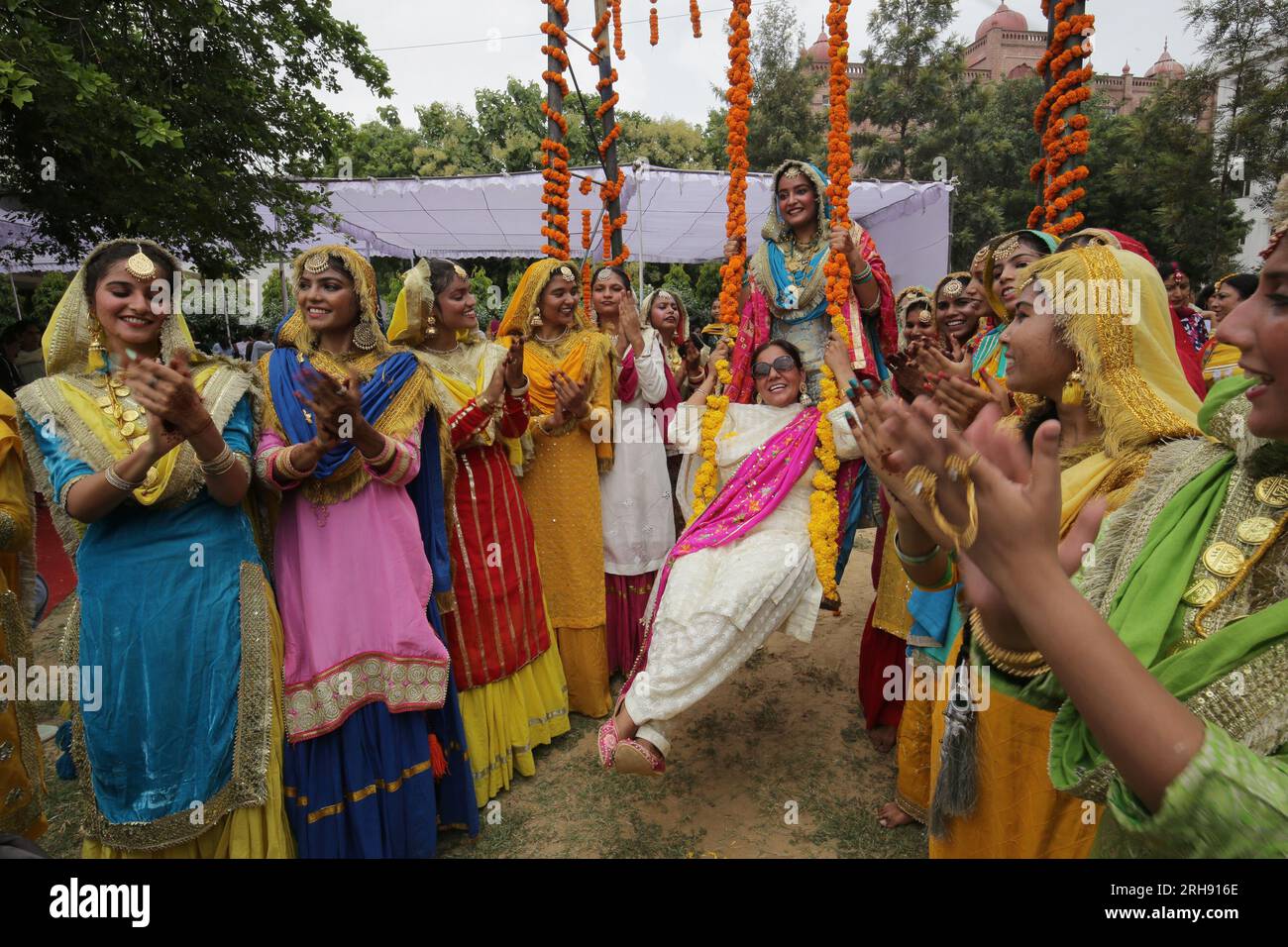 Amritsar. 14th Aug, 2023. Women in traditional Punjabi attire celebrate