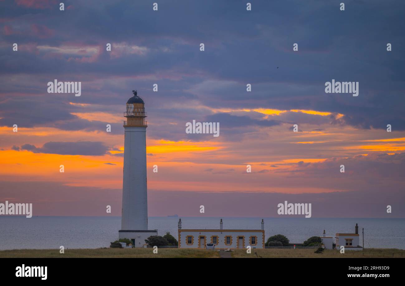 Dunbar, UK. 14th August 2023  UK Weather,  sunrise  Fist light as the dawn breaks and the sun rises behind Barns Ness lighthouse, near Dunbar, East Lothian, Scotland.  Barns Ness Lighthouse is 3.1 miles (5 km) from Dunbar and was constructed by the engineers and brothers David A. Stevenson and Charles Alexander Stevenson,[1] cousins of the novelist Robert Louis Stevenson, between 1899 and 1901  The lighthouse was staffed by a lighthouse keeperuntil 1986, when it was  when it was electrified.   Picture Phil Wilkinson  / Alamy Live News Stock Photo