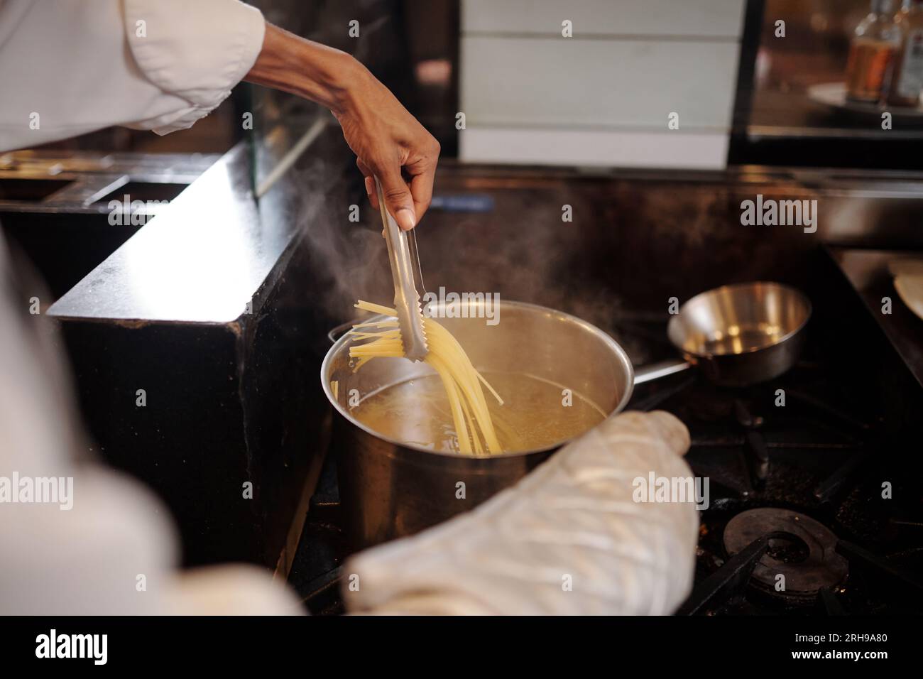 Cooking pasta hands hi-res stock photography and images - Alamy