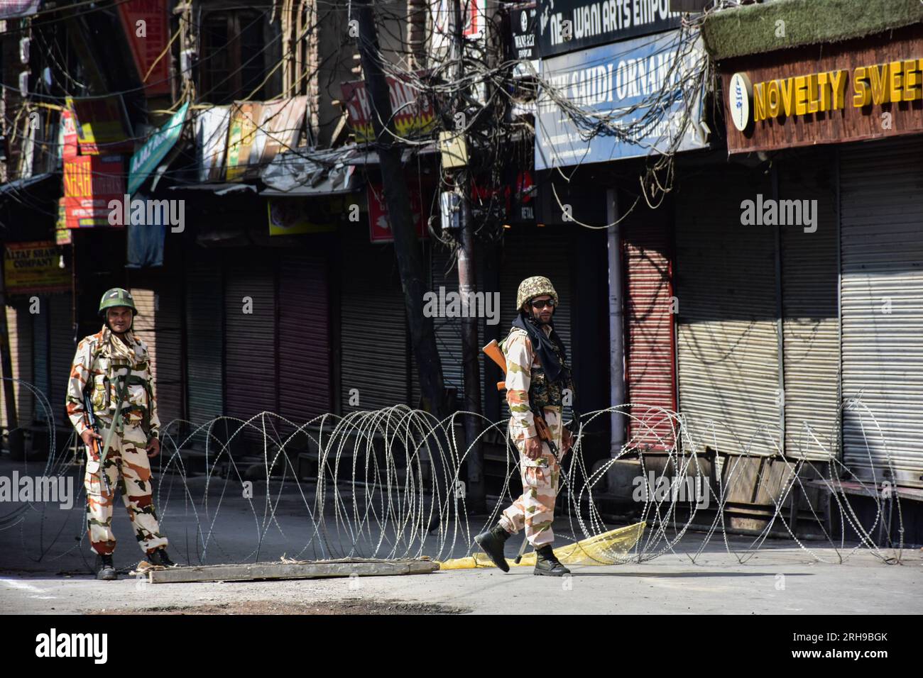 Government forces stand alert at the temporary check-post during the India's 77th Independence Day in Srinagar. Stock Photo