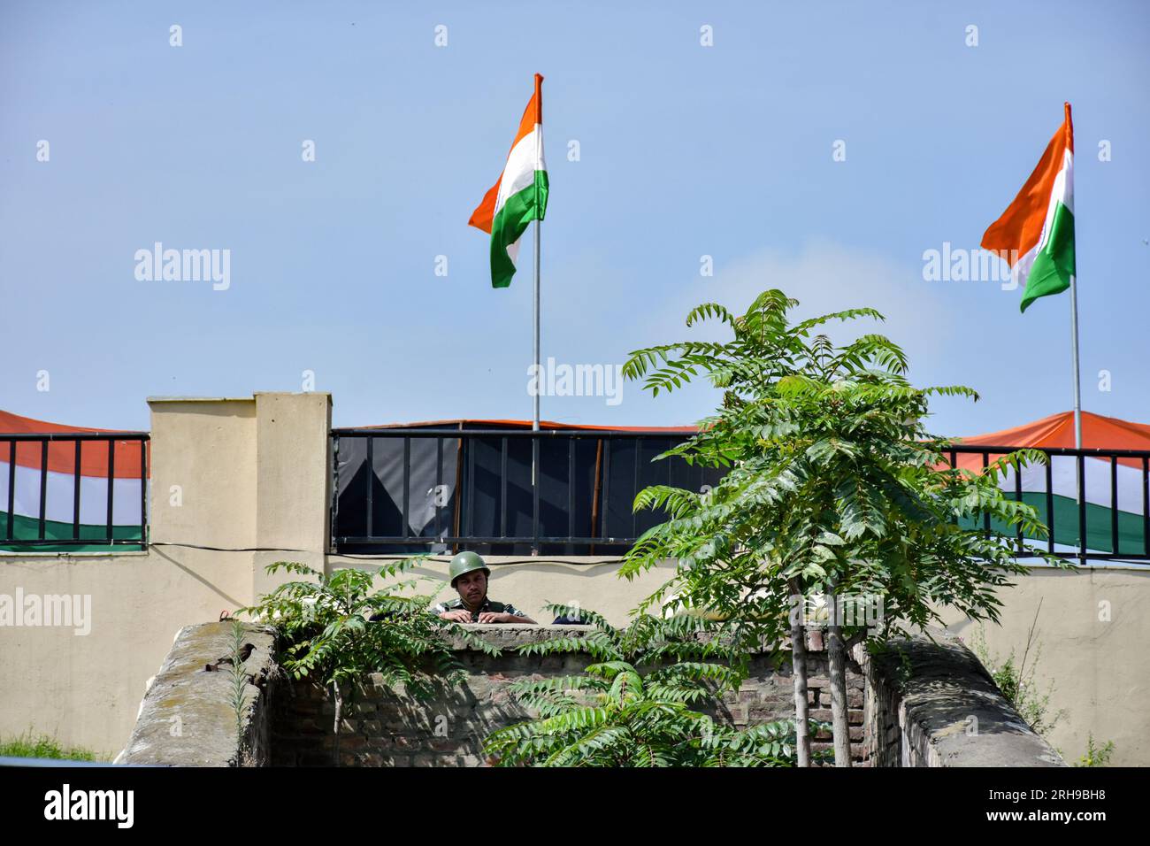A paramilitary trooper keeps vigil during the India's 77th Independence Day in Srinagar. Stock Photo