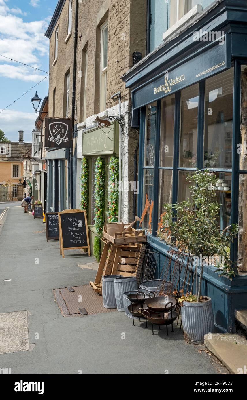 Row of shops stores local independent businesses in summer Market