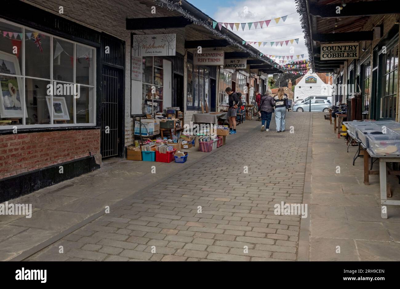 Row of shops stores local independent businesses in The Shambles in summer Malton North Yorkshire England UK United Kingdom GB Great Britain Stock Photo